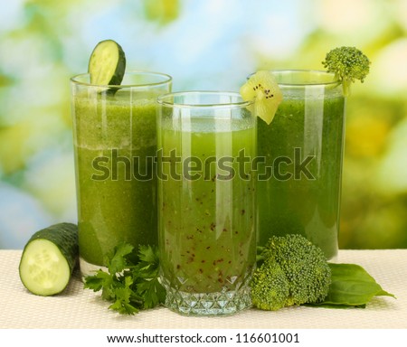 Three kinds of green juice on bright background