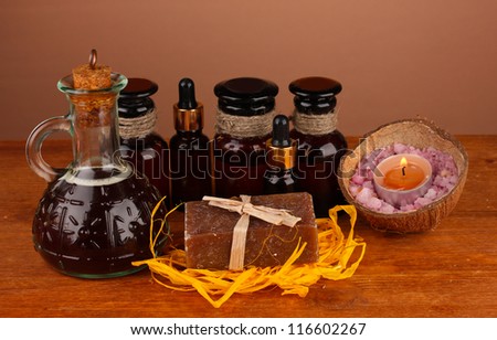 ingredients for soap making on brown background