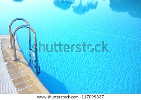 Hotel swimming pool with sunny reflections Hotel swimming pool with sunny reflections