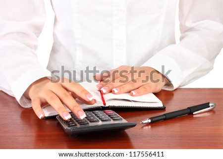 Woman's hands counts on the calculator, close-up