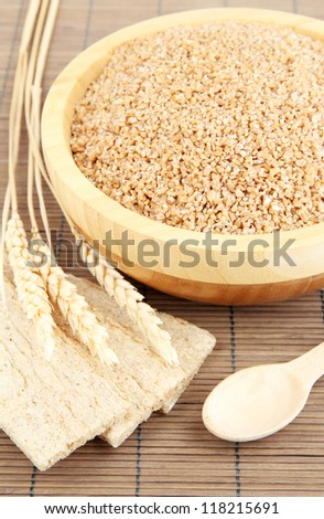 Wooden bowl full of wheat bran
