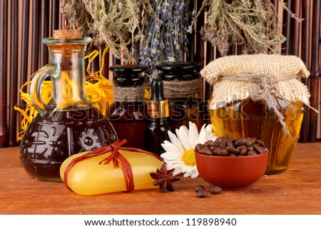 ingredients for soap making on brown background
