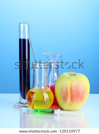 Genetically modified food on blue background