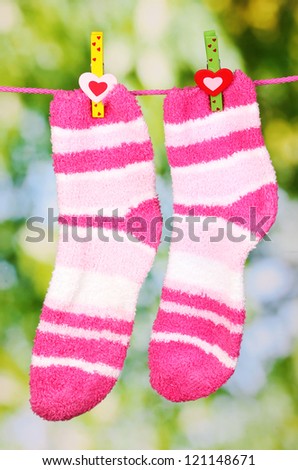 Pair of striped socks hanging to dry
