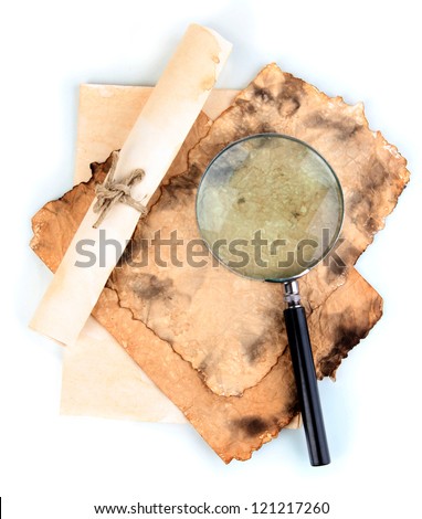 Old paper with magnifying glass isolated on white