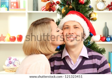 Romantic kiss under mistletoe