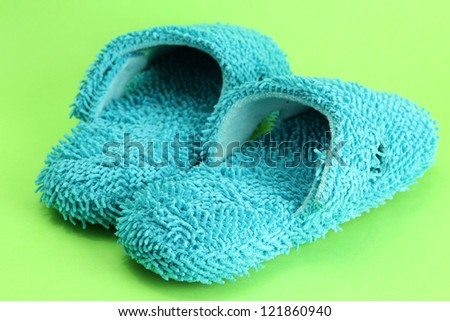bright slippers, on green background
