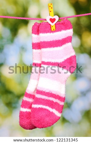 Pair of striped socks hanging to dry