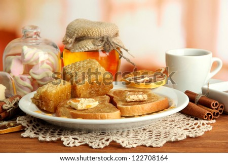 White bread toast with honey and cup of coffee in cafe