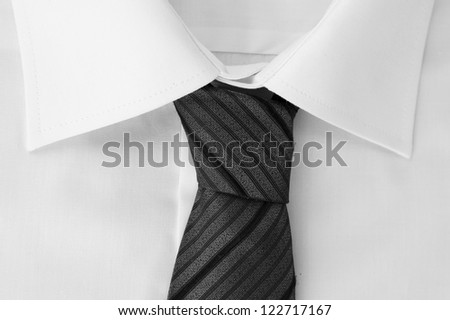 New white man\'s shirt with color tie on wooden background