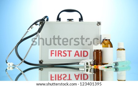 First aid box, on blue background