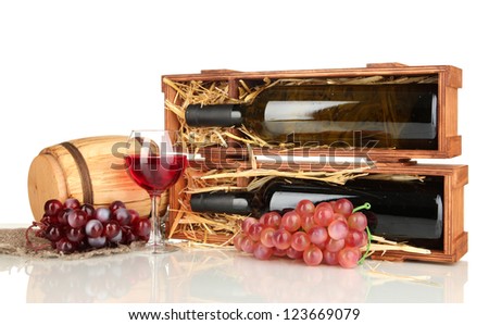 Wooden case with wine bottle, barrel, wineglass and grape isolated on white