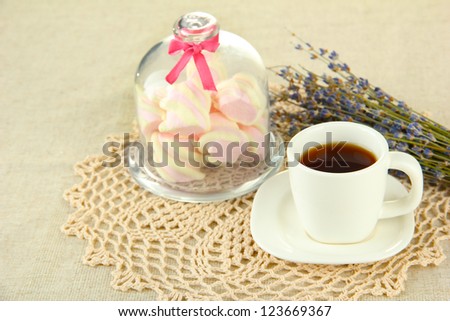 Marshmallows on saucer with transparent cover on light background