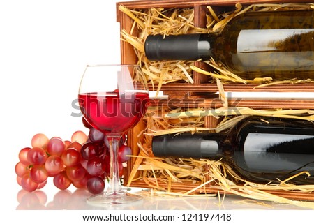 Wooden case with wine bottle, wineglass and grape isolated on white