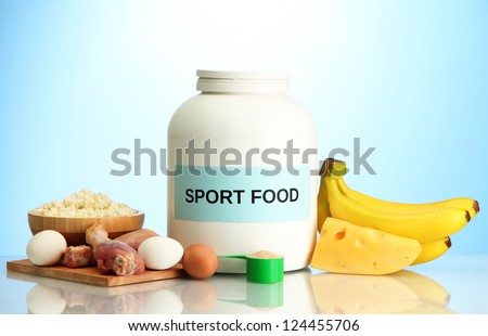 jar of protein powder and food with protein, on blue background