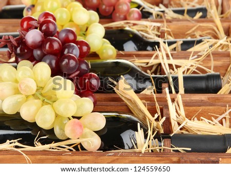 Wooden case with wine bottles close up