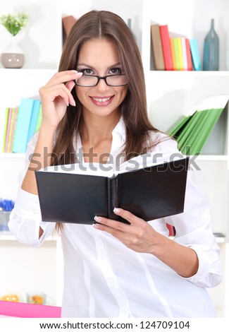 young business woman with notebook at office