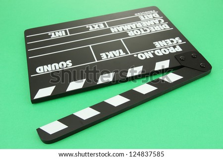 Movie production clapper board on color background