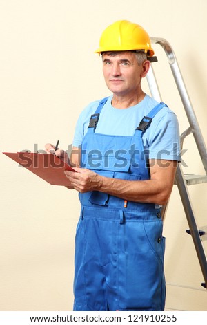 Builder enters into contract on work on wall background