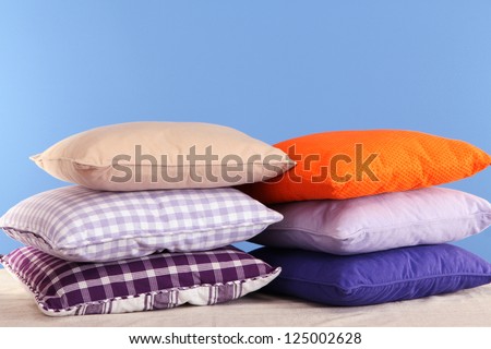 Hills colorful pillows on blue background