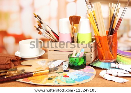 Artistic equipment: paint, brushes and art palette