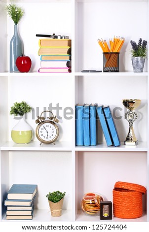 Beautiful white shelves with different home related objects