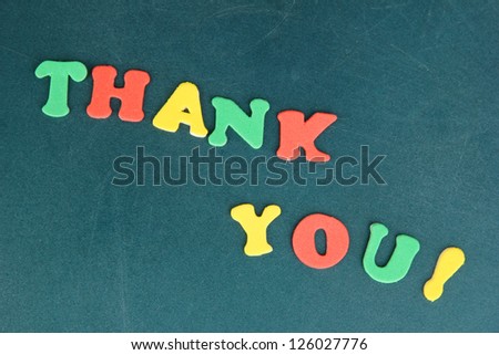 Thank you message written in colorful letters on school board close-up