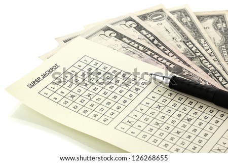 Lottery ticket with pen and money, isolated on white