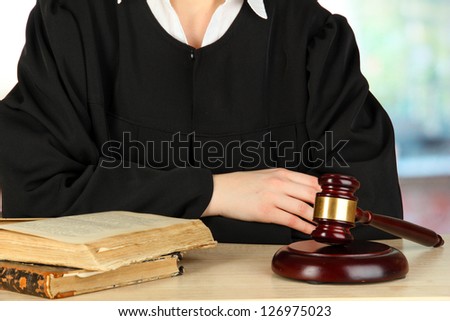 Judge sitting at table during court hearings on room background
