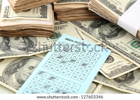 Lottery ticket and money, close up