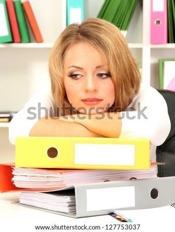 Tired business woman working in office