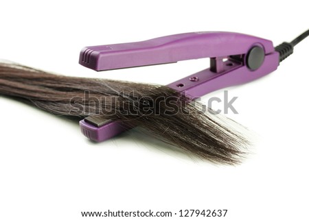 Hair straighteners and hair, isolated on white