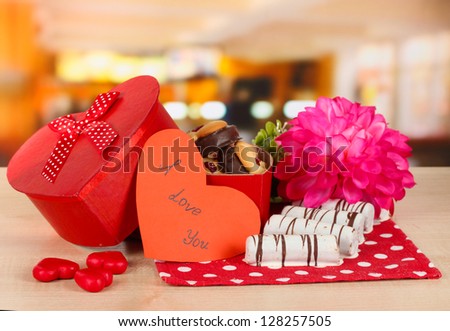 Sweet cookies in gift box on table in cafe