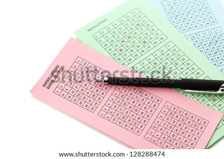 Lottery tickets and pen, isolated on white