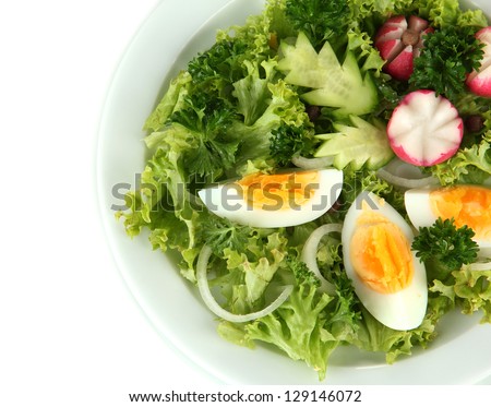 Fresh mixed salad with eggs, salad leaves and other vegetables, isolated on white - stock photo
