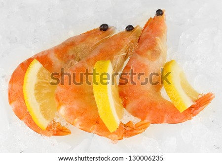 Shrimps with lemon isolated on white