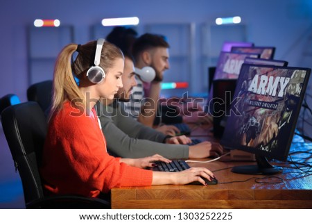 Young people playing video games at tournament