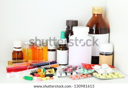 Medical bottles and pills on shelf Medical bottles and pills on shelf