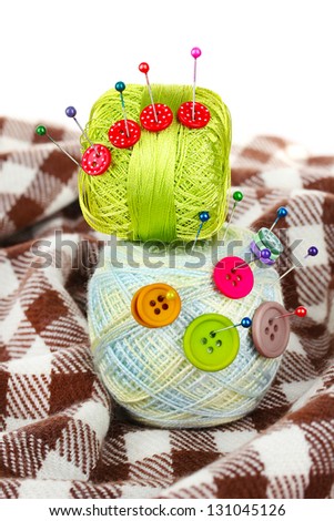 Buttons of different colors, and the two tangle thread
