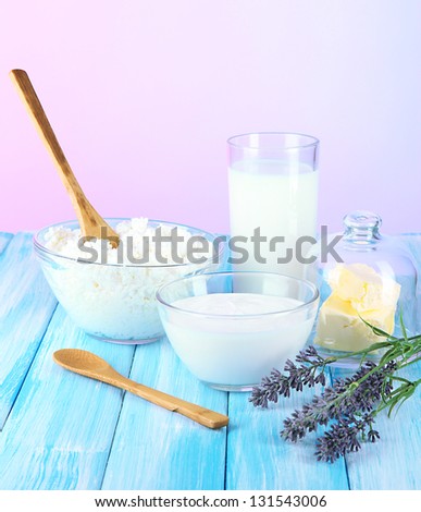 Glass of milk and cheese on  light background