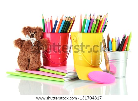 Colorful pencils with school supplies isolated on white
