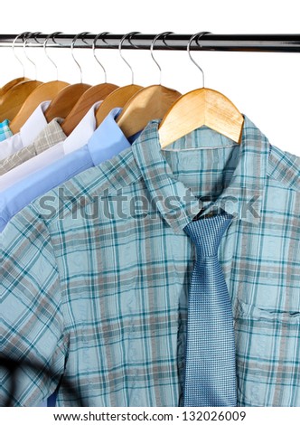  - stock-photo-shirts-with-ties-on-wooden-hangers-isolated-on-white-132026009