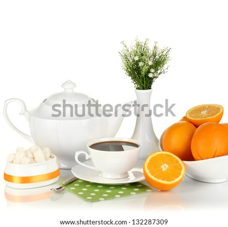 Beautiful white dinner service with oranges isolated on white