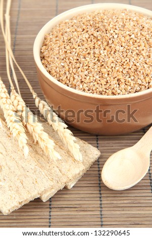 Brown bowl full of wheat bran