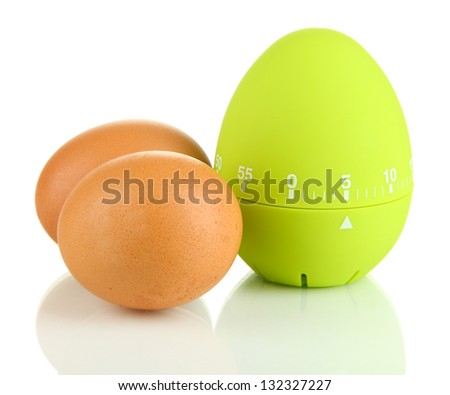 Green egg timer and eggs, isolated on white