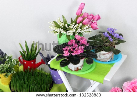 Color crate and table with decorative elements and flowers