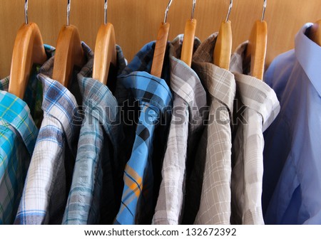 Colorful clothes hangers on gray background - Stock Image - Everypixel