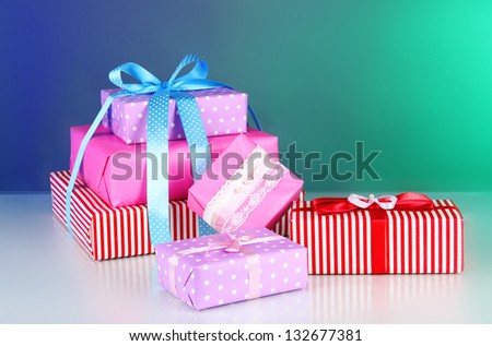 Various gift boxes on a colorful background