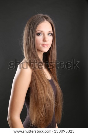 http://image.shutterstock.com/display_pic_with_logo/137002/133095023/stock-photo-portrait-of-beautiful-woman-with-long-hair-on-black-background-133095023.jpg