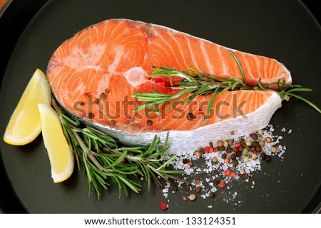 Fresh salmon steak on pan, close up
